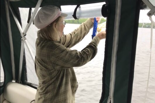 Citizen scientist collecting data for the Algae Monitoring Program