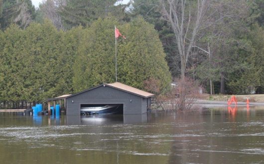 Photo of a flooded boathouse by Richard Lammers