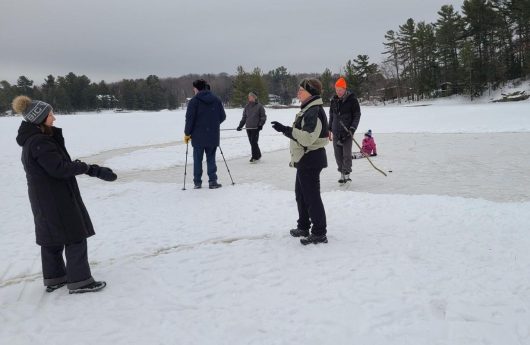 People playing on the ice on Brandy Lake in 2021