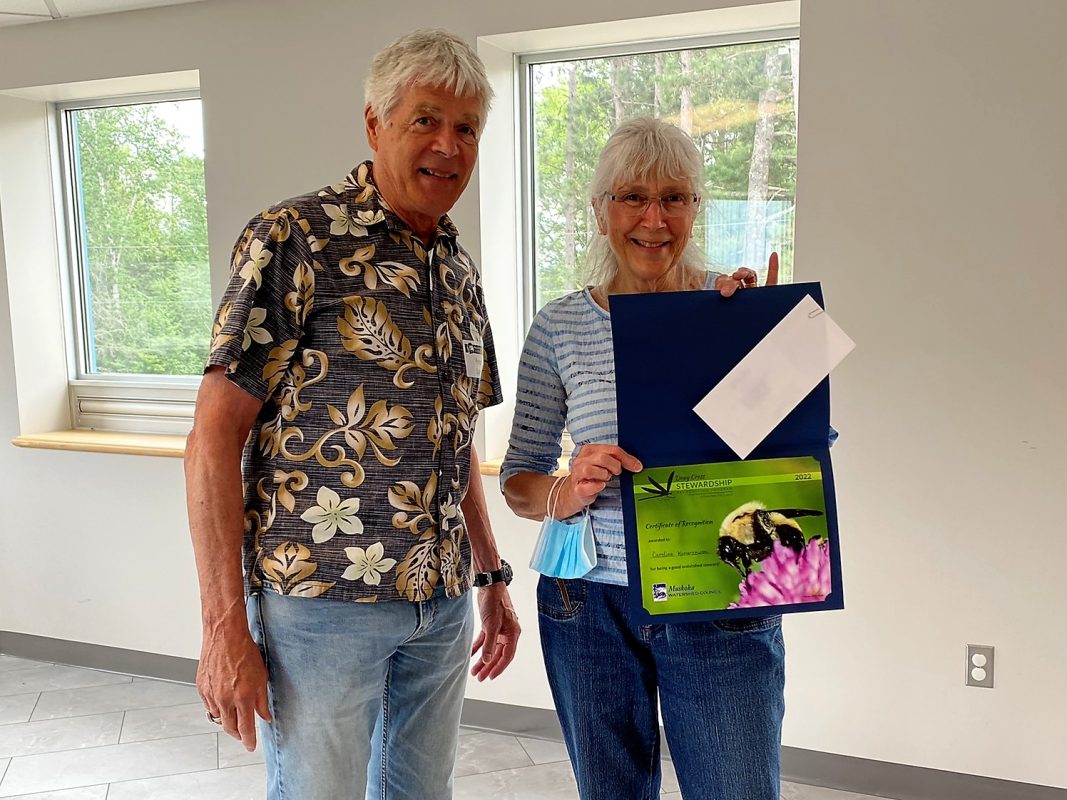 MWC Chair Peter Sale presents Caroline Konarzewski with the stewardship award.