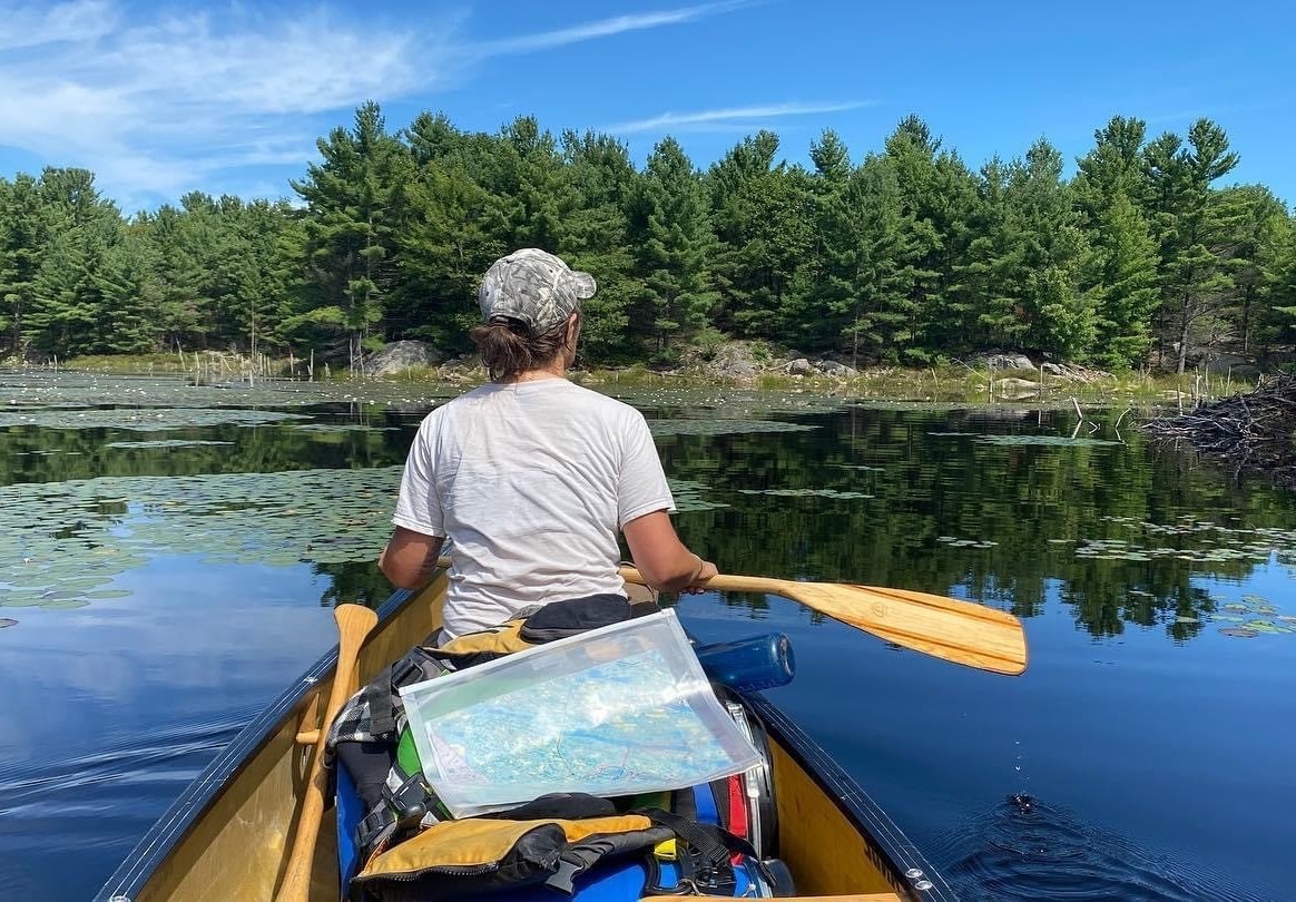 Photo of someone canoeing in Muskoka